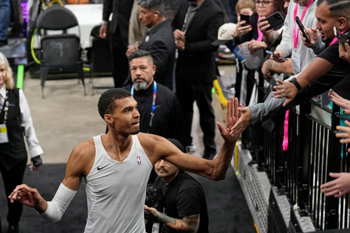 Nov 12, 2023; San Antonio, Texas, USA; San Antonio Spurs center Victor Wembanyama (1) greets fans before a game against the Miami Heat at Frost Bank Center.